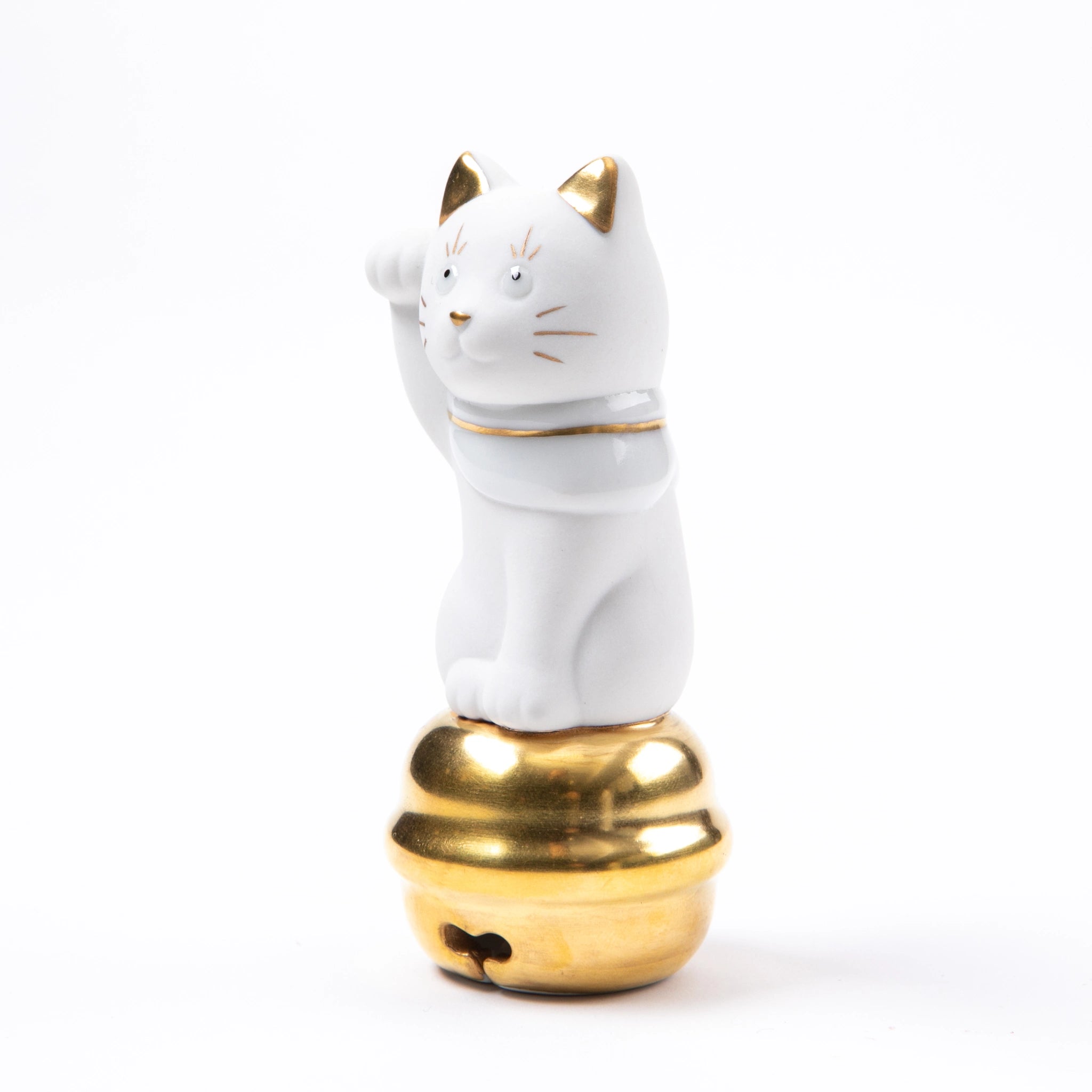 A three-quarter side view of the right-handed Maneki Neko, showcasing its delicate gold-painted details and traditional white bib.