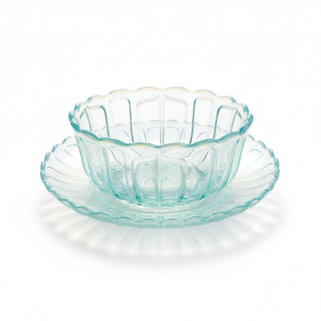 Japanese retro turquoise glass bowl with decorative rim on a white background
