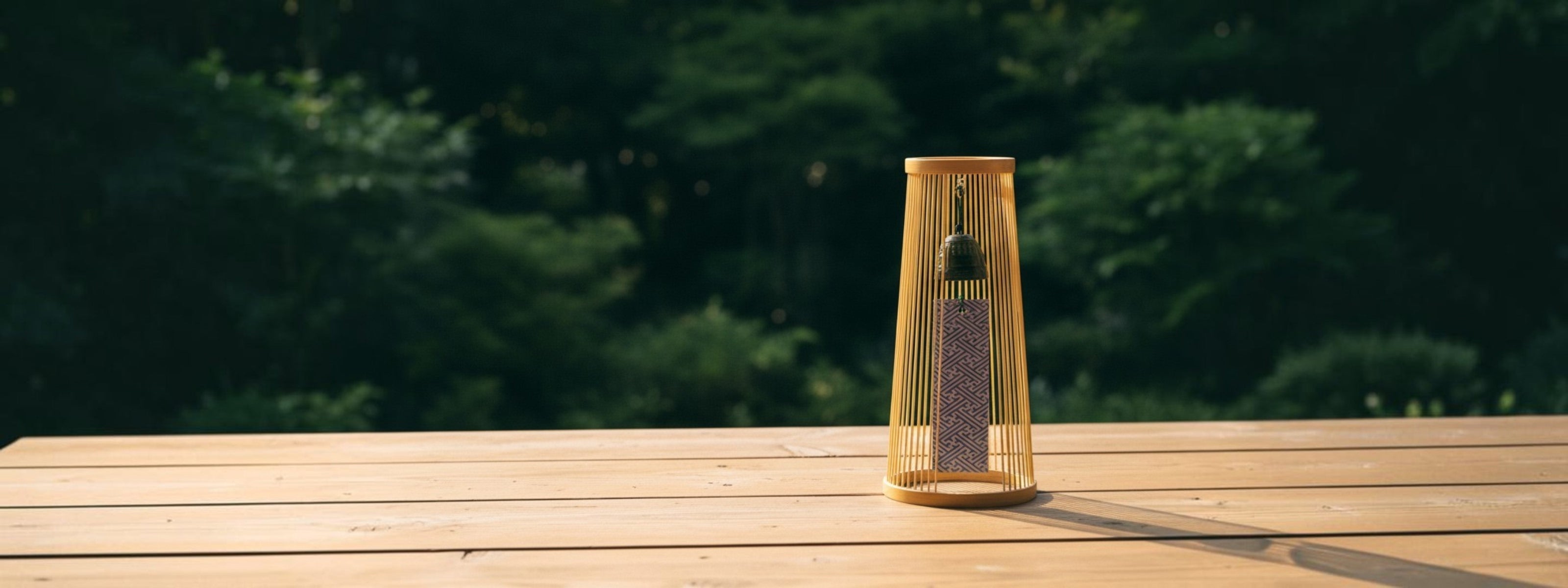 Suruga Sensuji Bamboo Wind Chime on a wooden surface with a blurred natural background