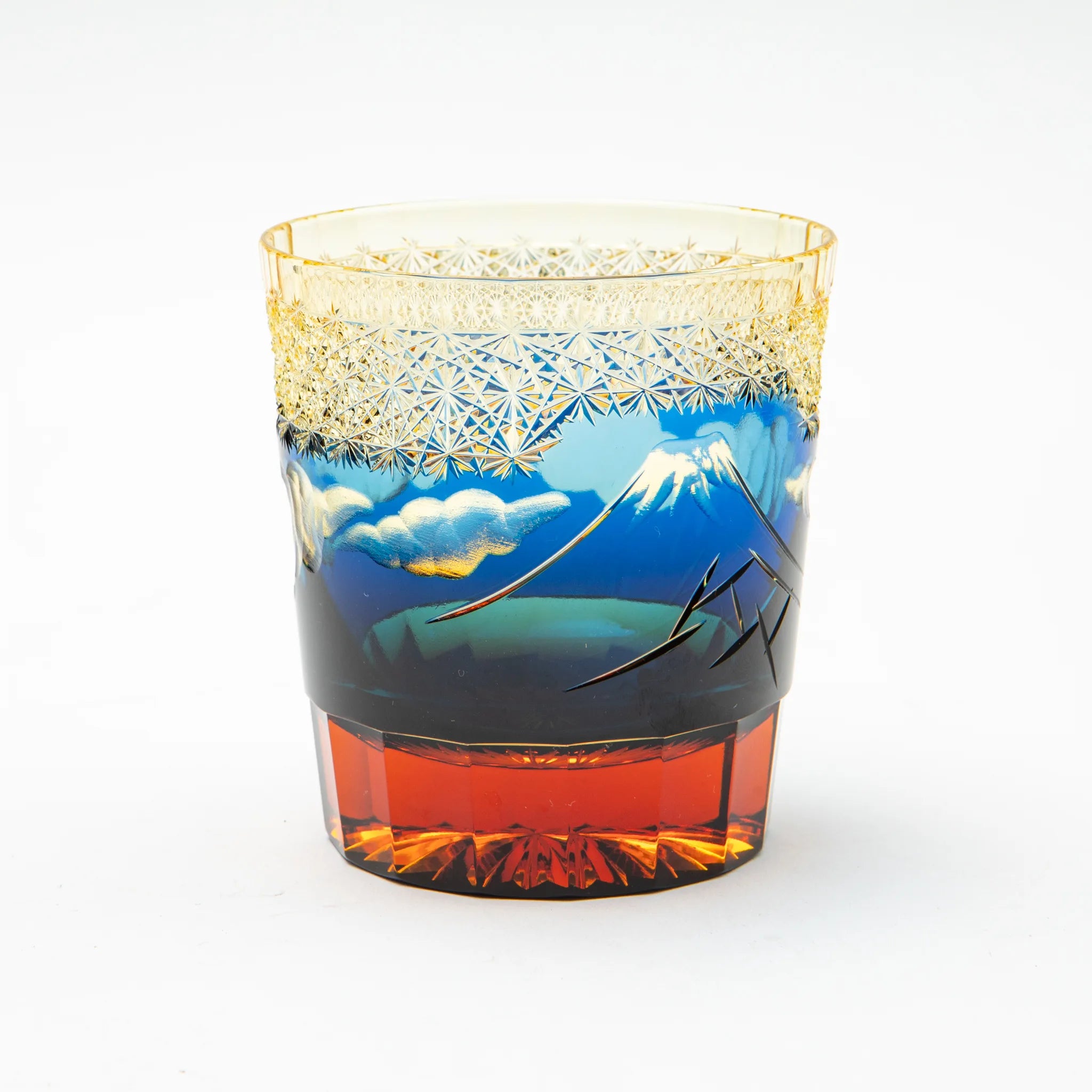Decorative Edo kiriko glass with mountain and landscape design on a white background