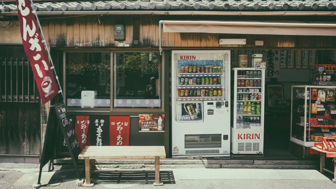 A nostalgic Japanese storefront with vending machines, wooden facade, and traditional signage, showcasing local snacks and drinks.