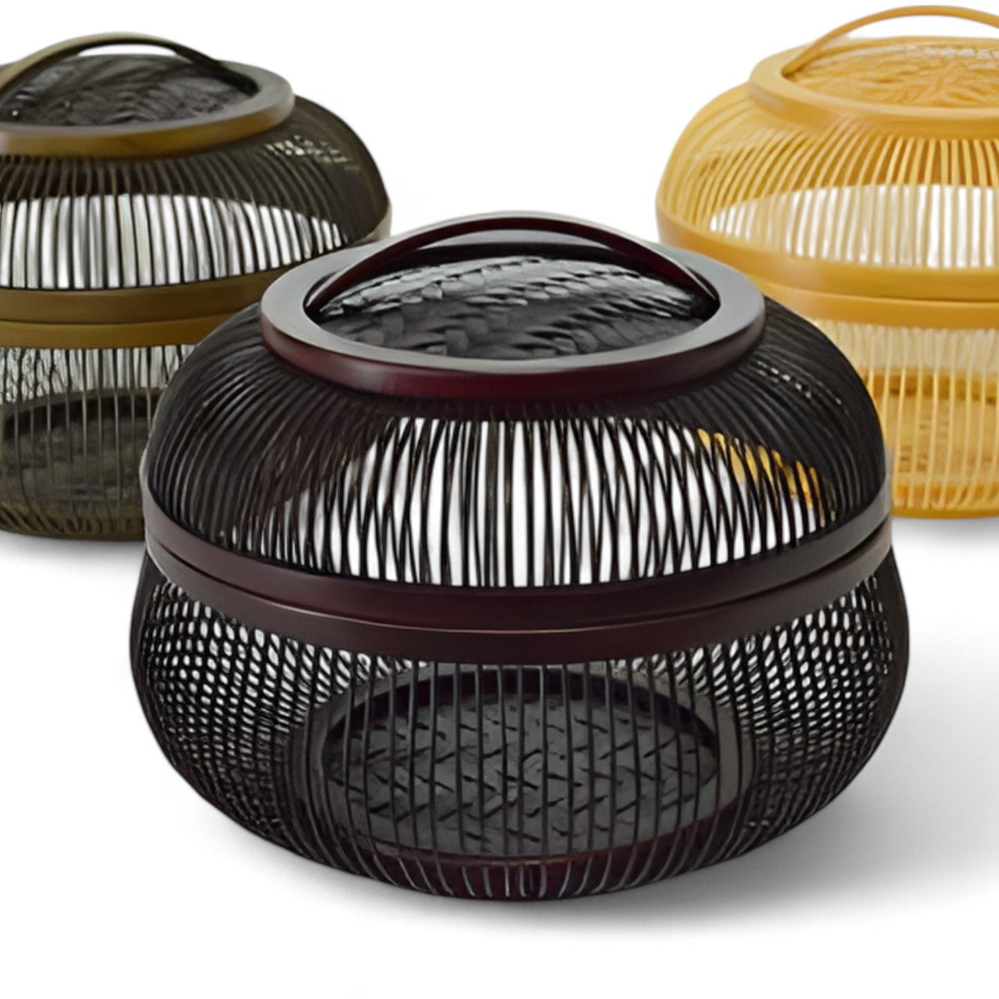 Set of three bamboo baskets in black, brown, and yellow, each with intricate open-weave designs and matching lids, showcasing traditional Japanese craftsmanship.
