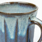 Close-up of the Blue Shodai Mug’s dripping white and blue glaze texture with a glossy finish.