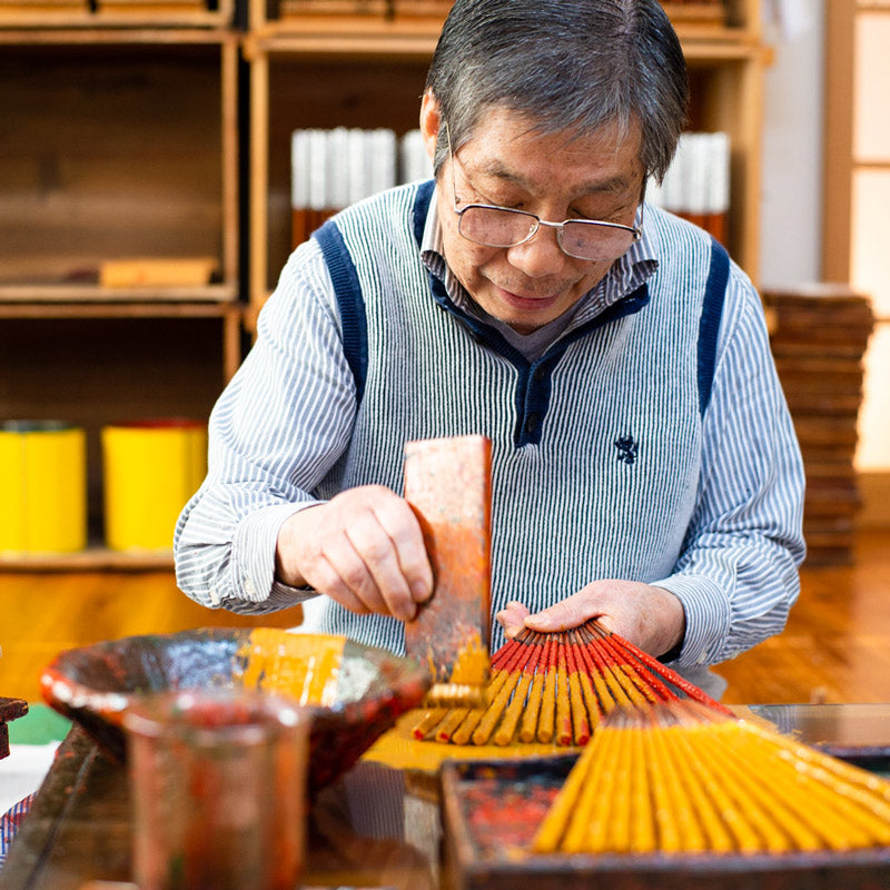 Artisan hand painting lacquer to chipsticks