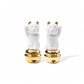 A pair of white porcelain Maneki Neko figurines with gold accents, each sitting atop a golden bell. One cat raises its left paw, while the other raises its right, symbolizing luck and prosperity.