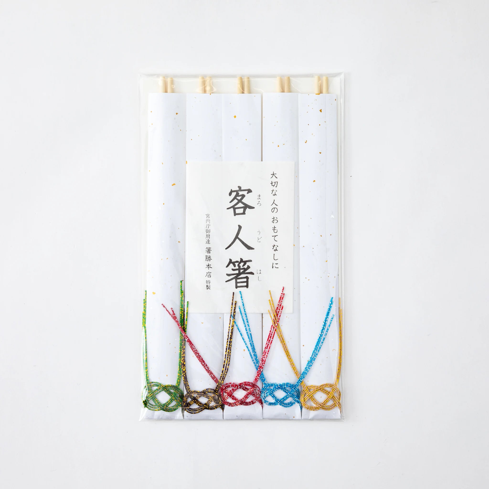 Packaged set of 5 guest chopsticks with white paper sleeves, accented by colorful mizuhiki knots in green, brown, red, blue, and gold, showcasing traditional Japanese craftsmanship.
