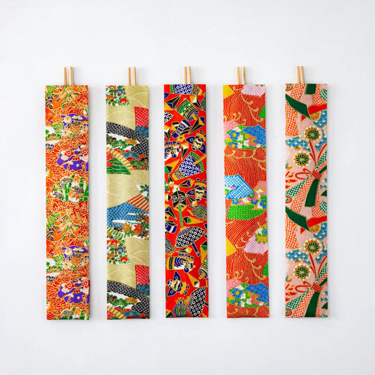 Set of five Yuzen Chiyogami Pattern Yoshino Cedar Ranchu Chopsticks, featuring intricate Japanese chiyogami patterns in bold and colorful designs, laid out against a clean white background.