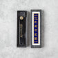 Similar to the first image, this one shows the Higonokami knife in a black box with an identical label in gold and blue, enhancing the classic, traditional appeal. The color difference in the packaging may indicate a variation in model or series.