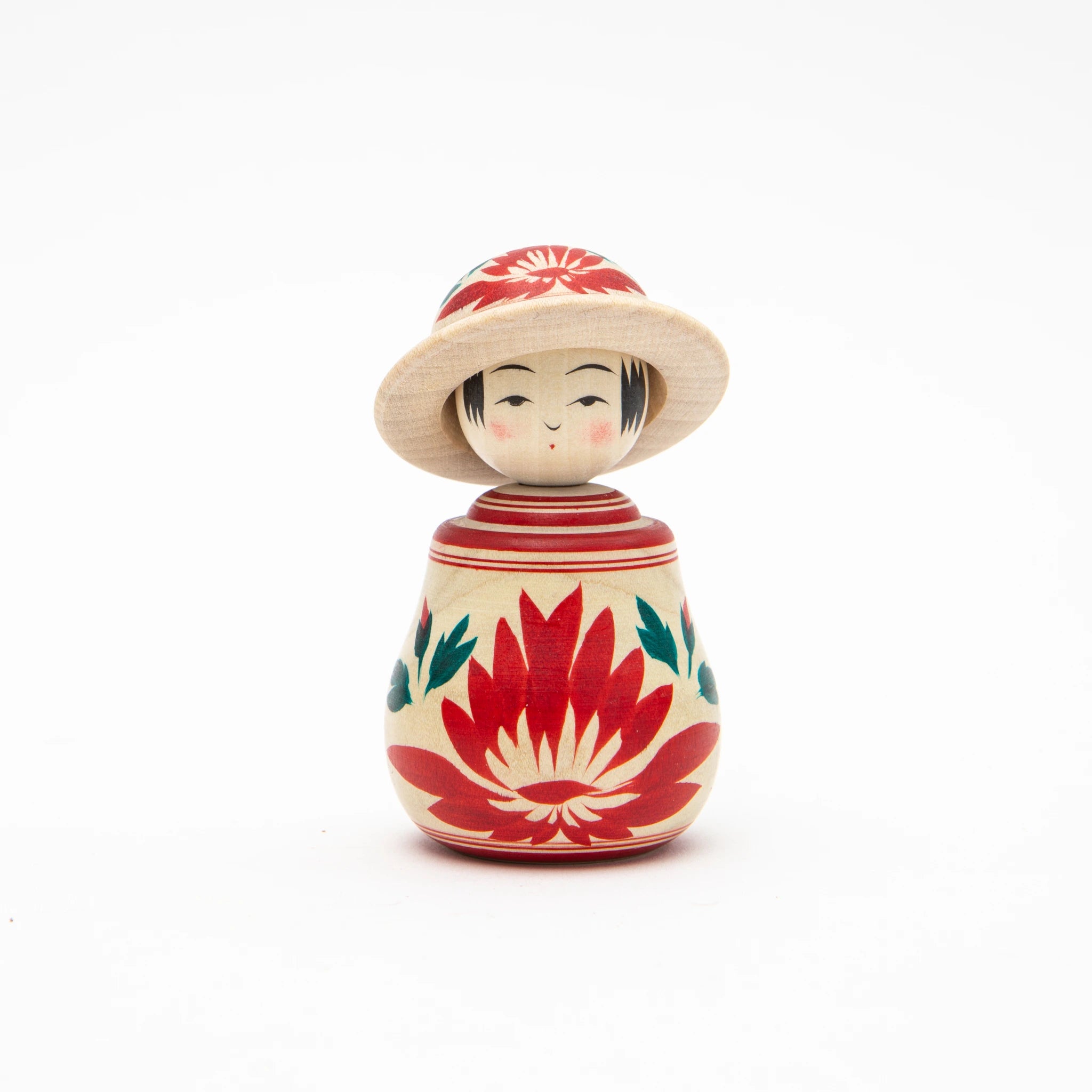 Front view of a 9cm Boshi Nemariko kokeshi doll by Kakizawa Kokeshi Studio, showing a wide rounded seated body hand-painted with large red chrysanthemums and teal leaves, a lathe-turned wide-brimmed hat with chrysanthemum detail, and a composed face with rosy cheeks beneath.