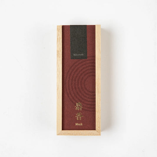 A rectangular wooden box with a deep red label and gold kanji, containing Kosaido hitotoki incense in musk scent, placed on a white background.