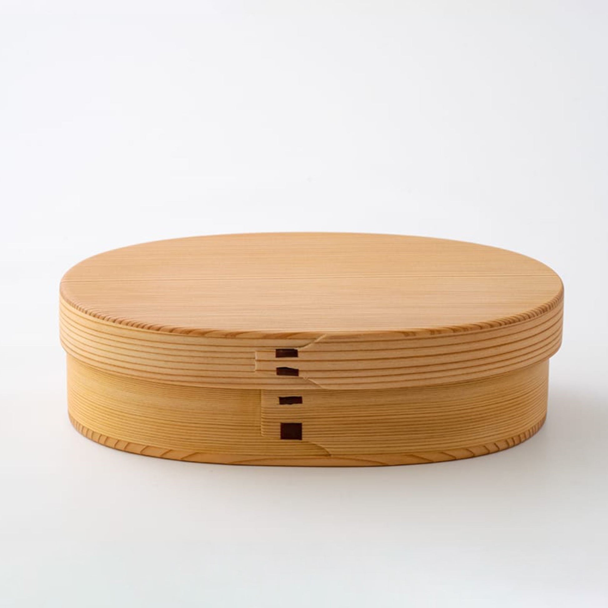 Closed Magewappa Omotenashi bento box, crafted from natural wood with a smooth finish - traditional Japanese lunchbox.