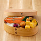 Magewappa Omotenashi bento box filled with Japanese cuisine, showcasing elegant food presentation in a handcrafted wooden box.