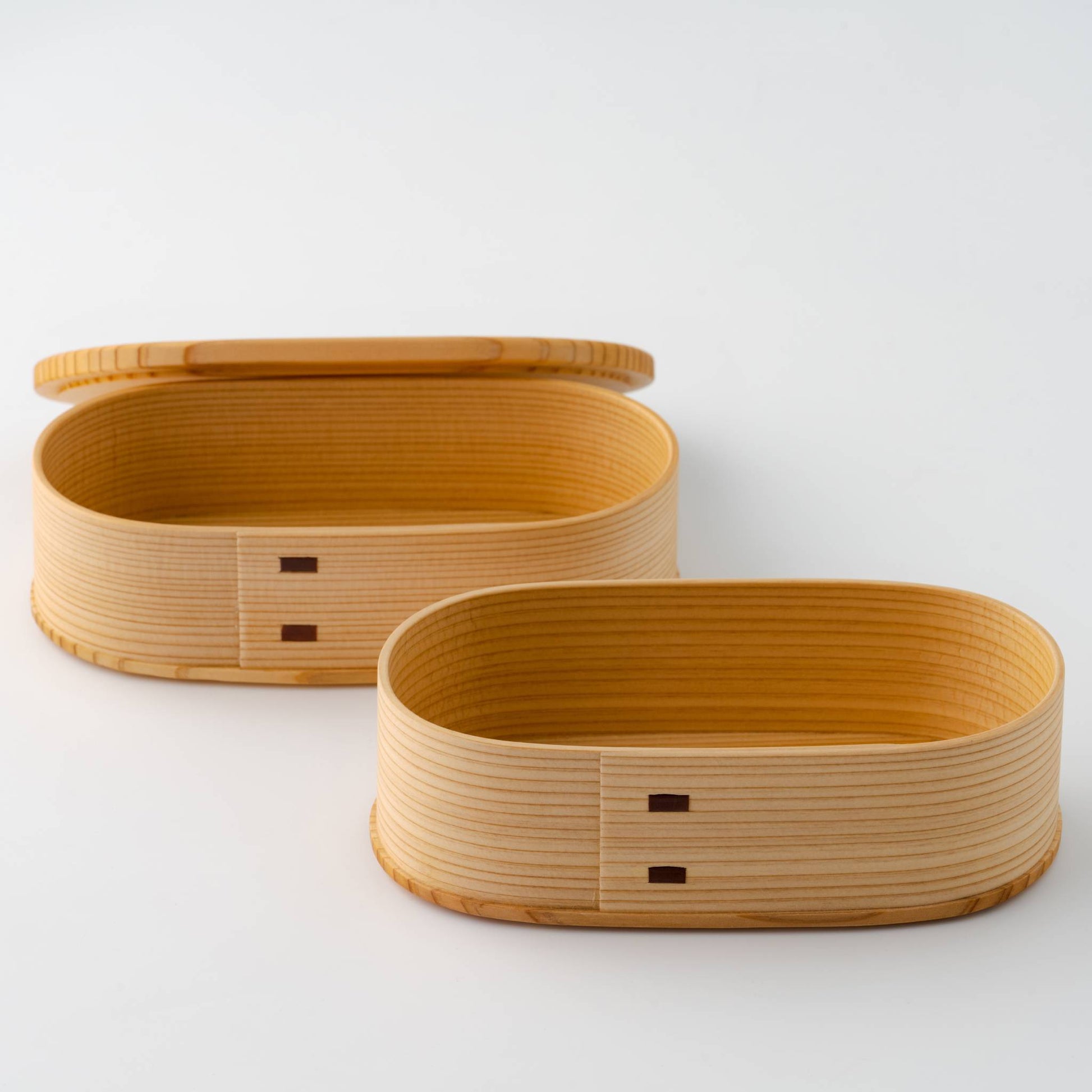 Magewappa Yayoi two-tier bento box opened to reveal separate compartments for food storage - handcrafted Japanese wooden lunchbox.
