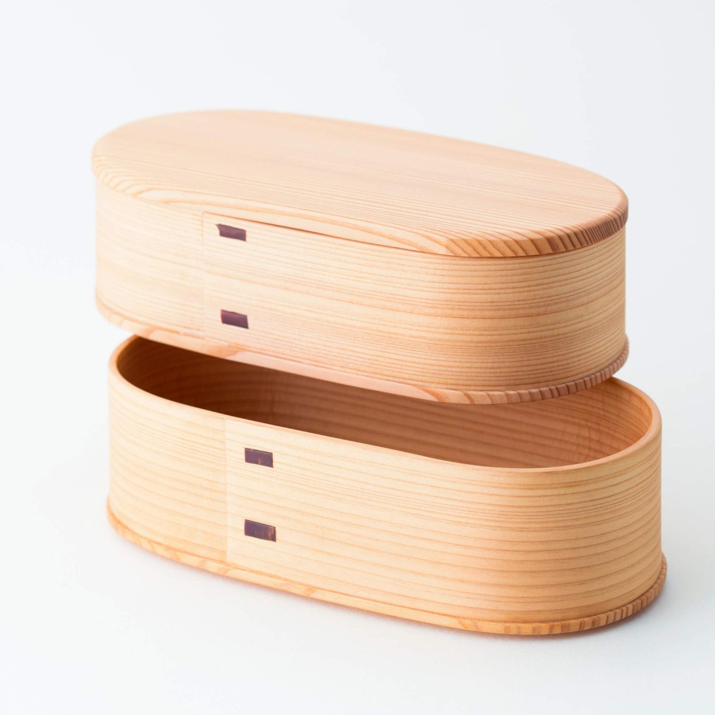 Stacked Magewappa Yayoi two-tier bento boxes, highlighting seamless joinery and natural wood grain - traditional Japanese design.