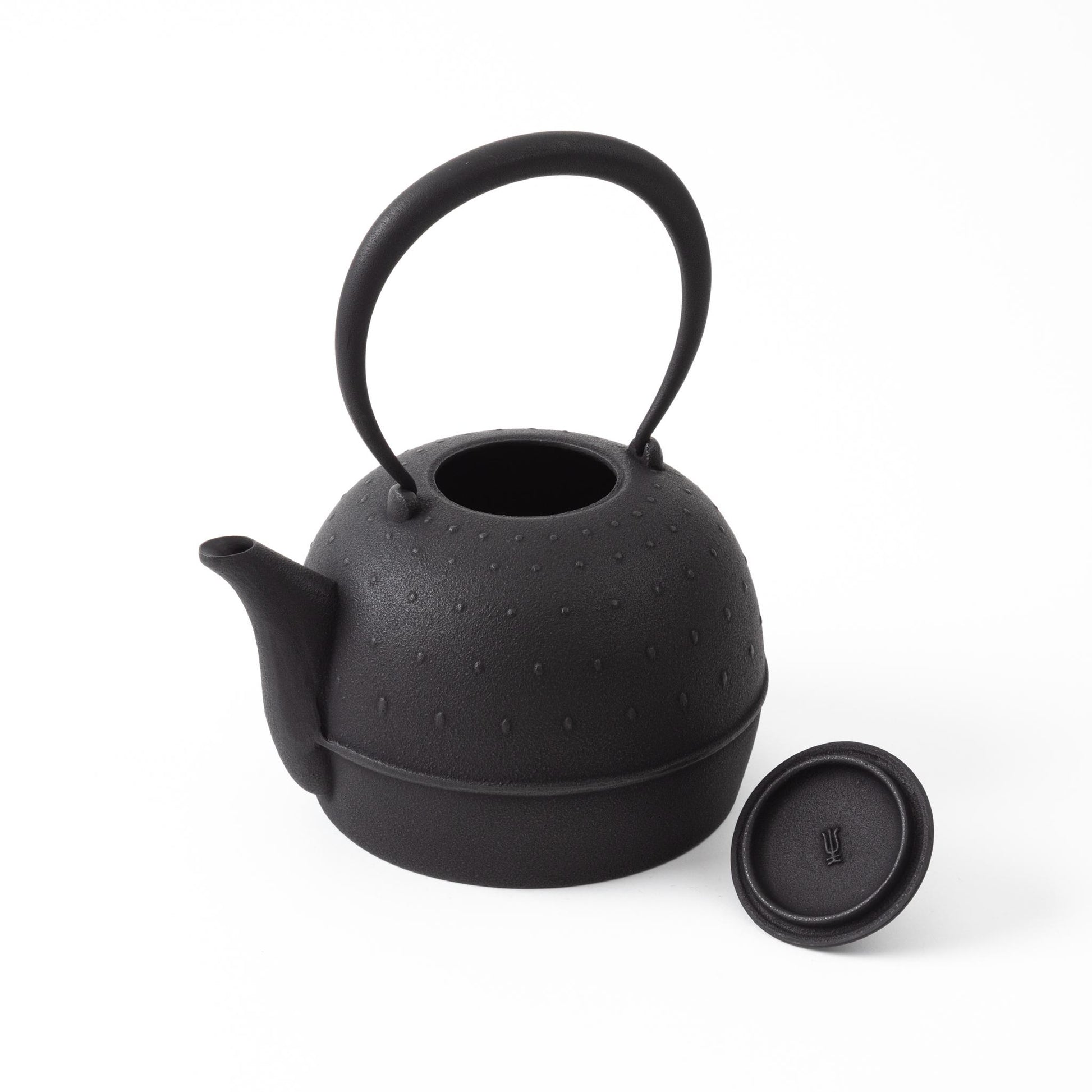 Classic Arare black Nambu cast iron teapot with lid removed, revealing the spacious interior - premium Japanese tea ware.