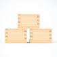 Three plain masu cups stacked together, showing fine wooden craftsmanship