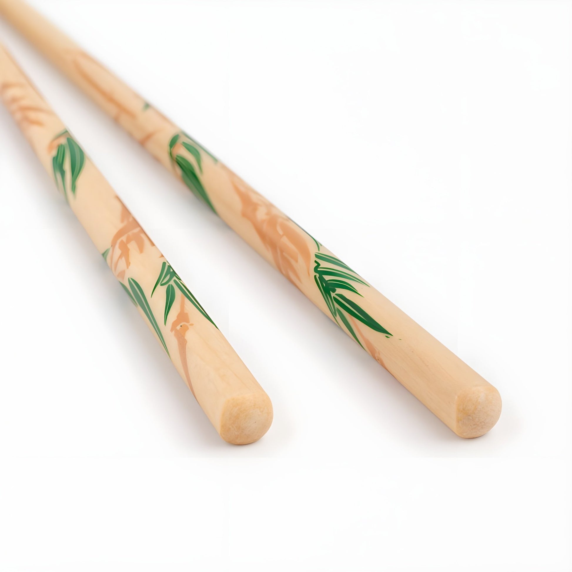 Close-up of natural wood chopsticks with green bamboo leaf designs on a beige background, highlighting intricate hand-painted details.