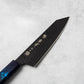 Close-up of the Sakai Takayuki Kurokage VG10 Kengata Santoku Knife's blade, highlighting its hammered texture, etched Japanese characters, and premium craftsmanship