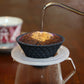Pouring the hot water to drip the coffee using Hasami ware ceramic coffee filter in black