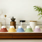 Five different colors of Sancera Hasami Ware Ceramic Mt. Fuji Coffee filter on the counter top