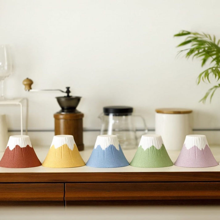 Five different colors of Sancera Hasami Ware Ceramic Mt. Fuji Coffee filter on the counter top