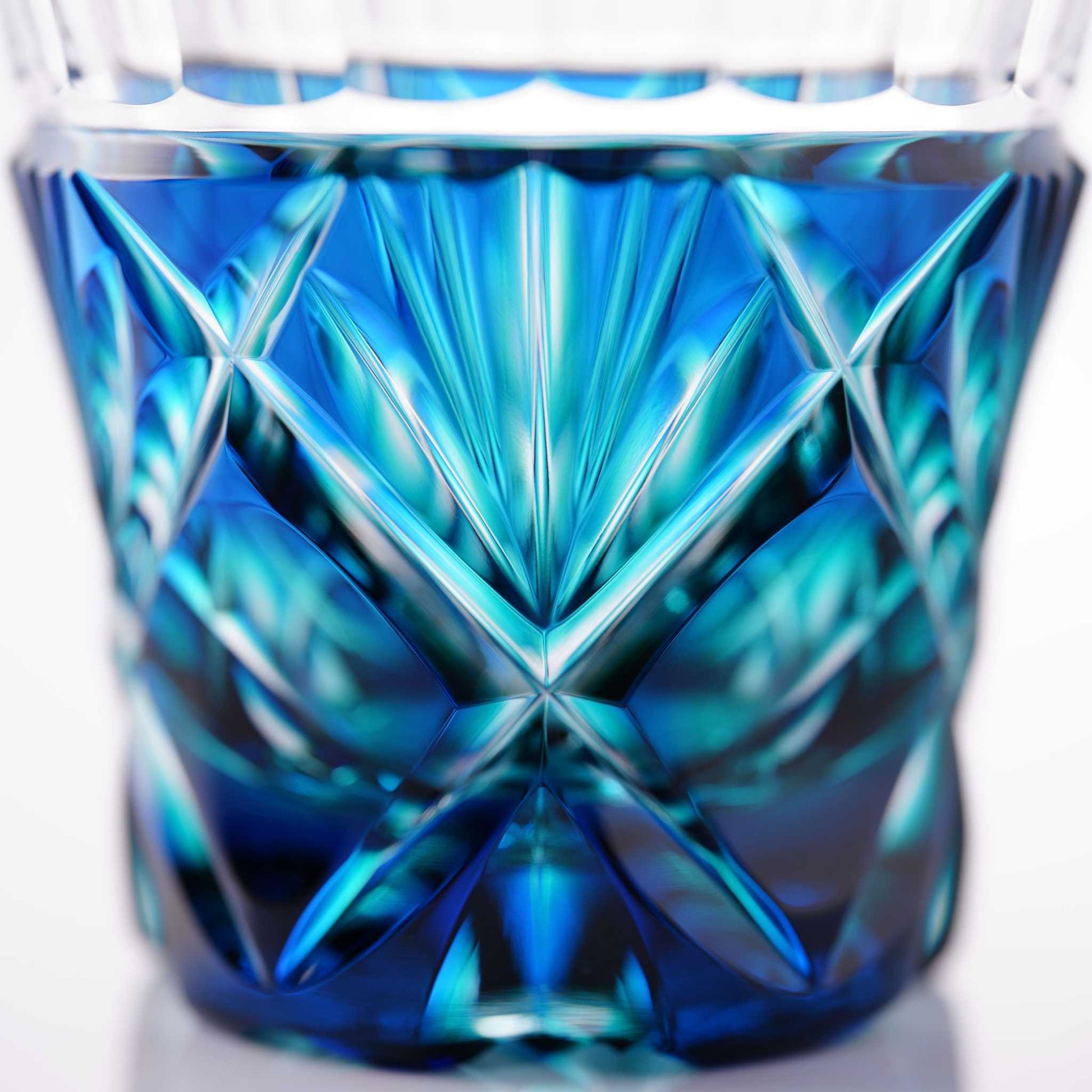 Detailed side view showcasing the elegant facets of the Lapis Green Satsuma Kiriko two-tone sake cup.