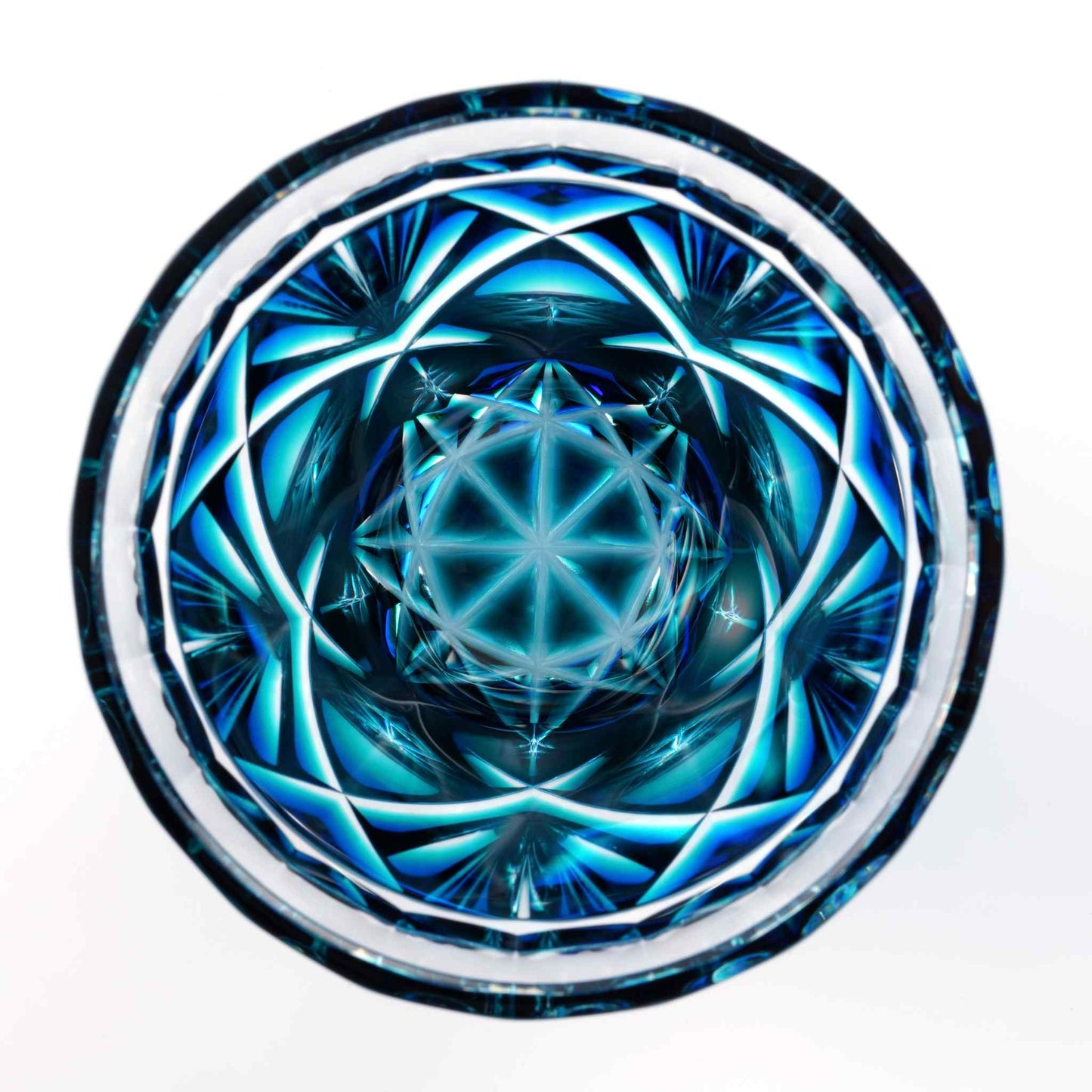 Top-down view of the intricate star pattern on the Satsuma Kiriko two-tone sake cup, Lapis Green color.