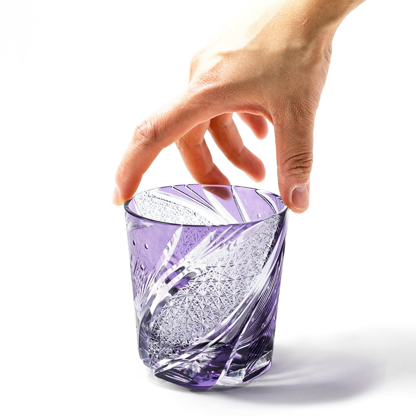 Hand holding purple Edo Kiriko Meteor Whiskey Glass from Tableau