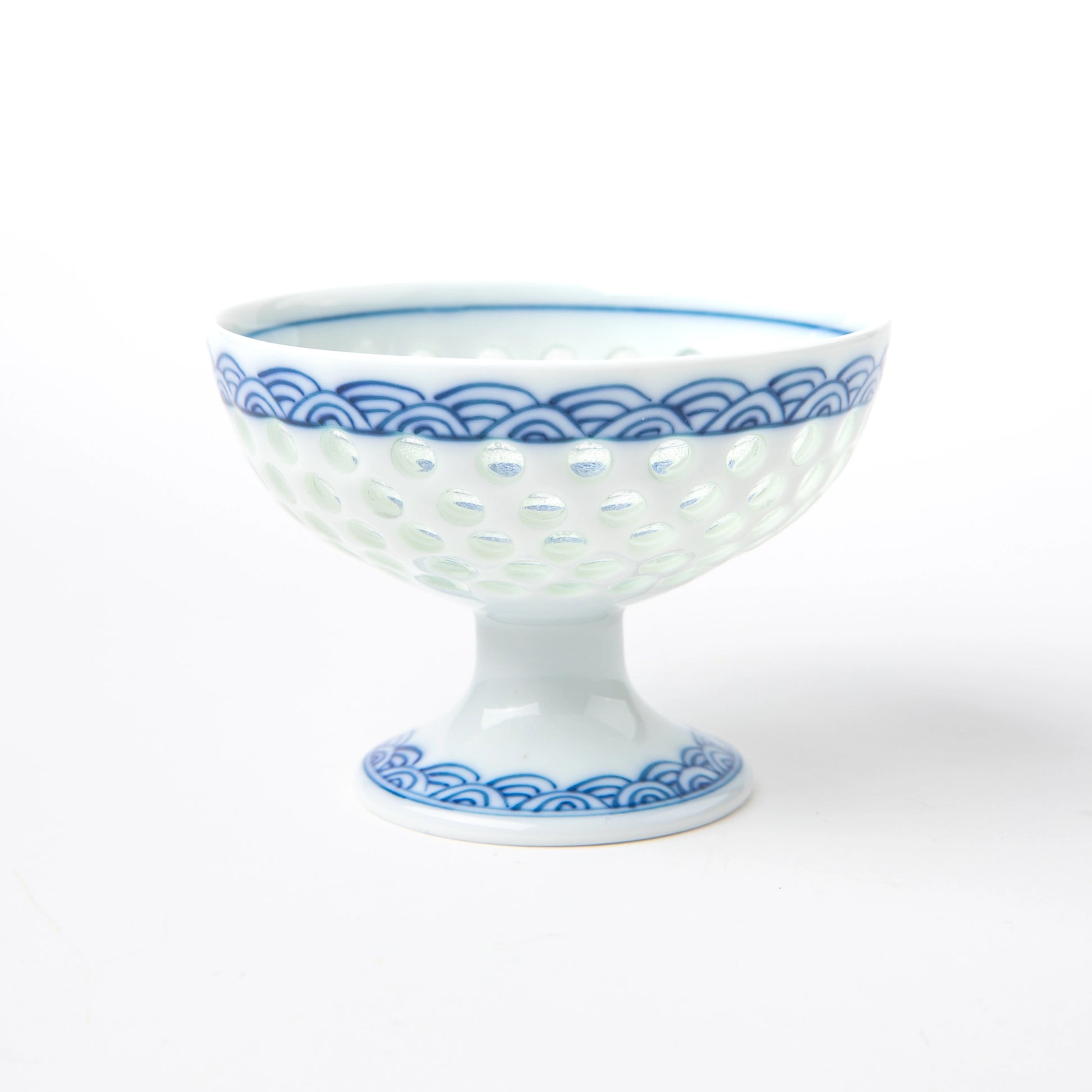 Tanshingama Goblet with pedestal base, celadon dotted texture, and classic wave motif around the rim.