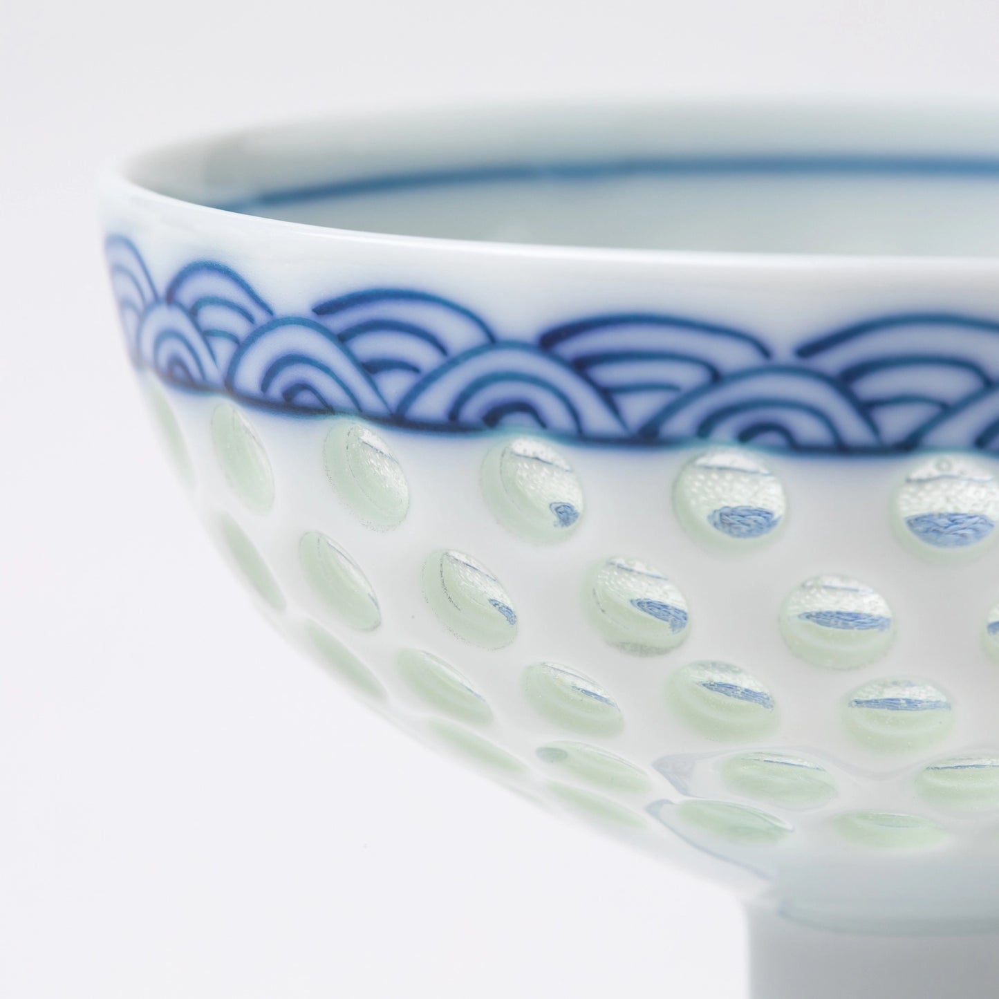 Close-up of the Tanshingama Goblet showing celadon dots and wave pattern detail.