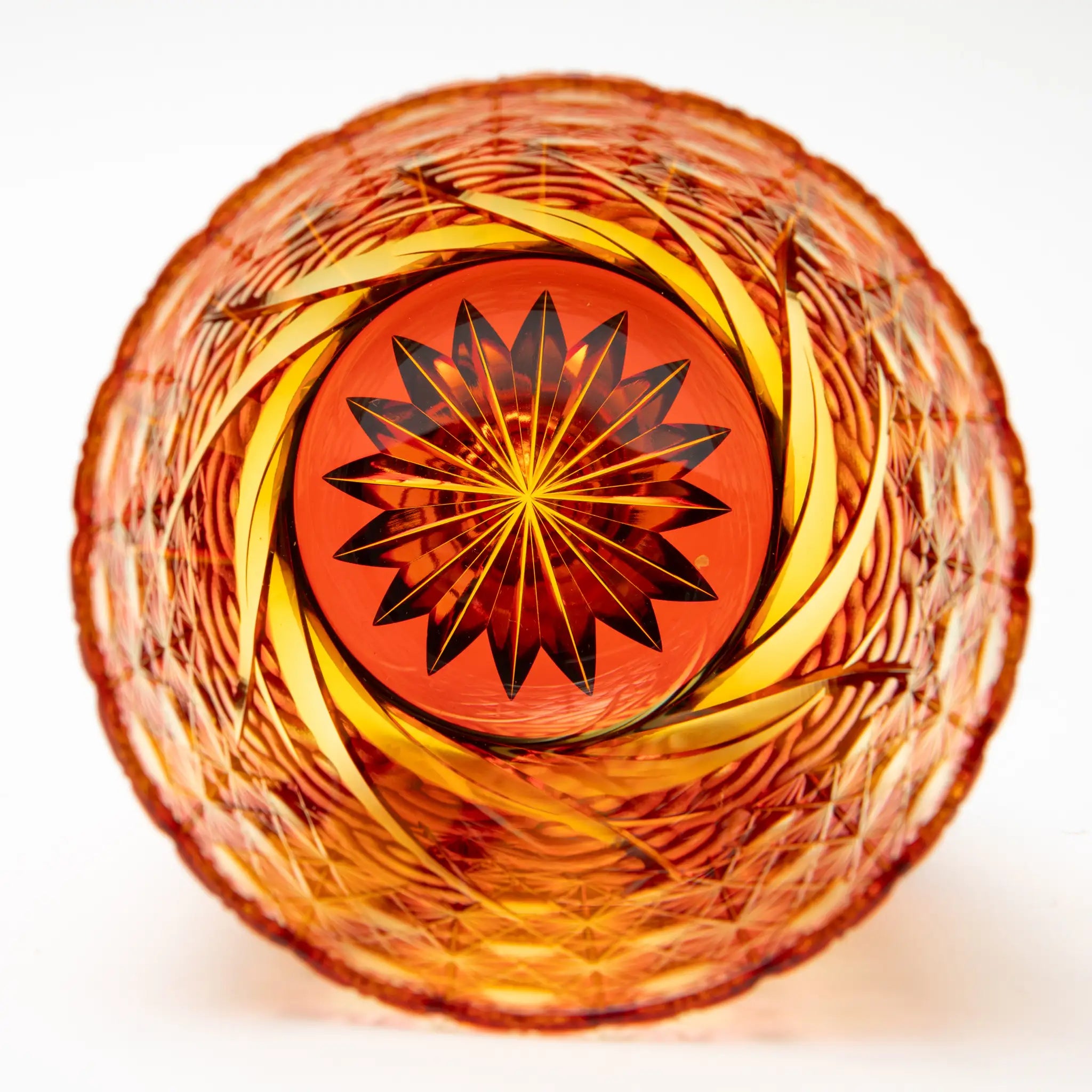 Decorative Edo Kiriko glass inside with a starburst pattern on a white background