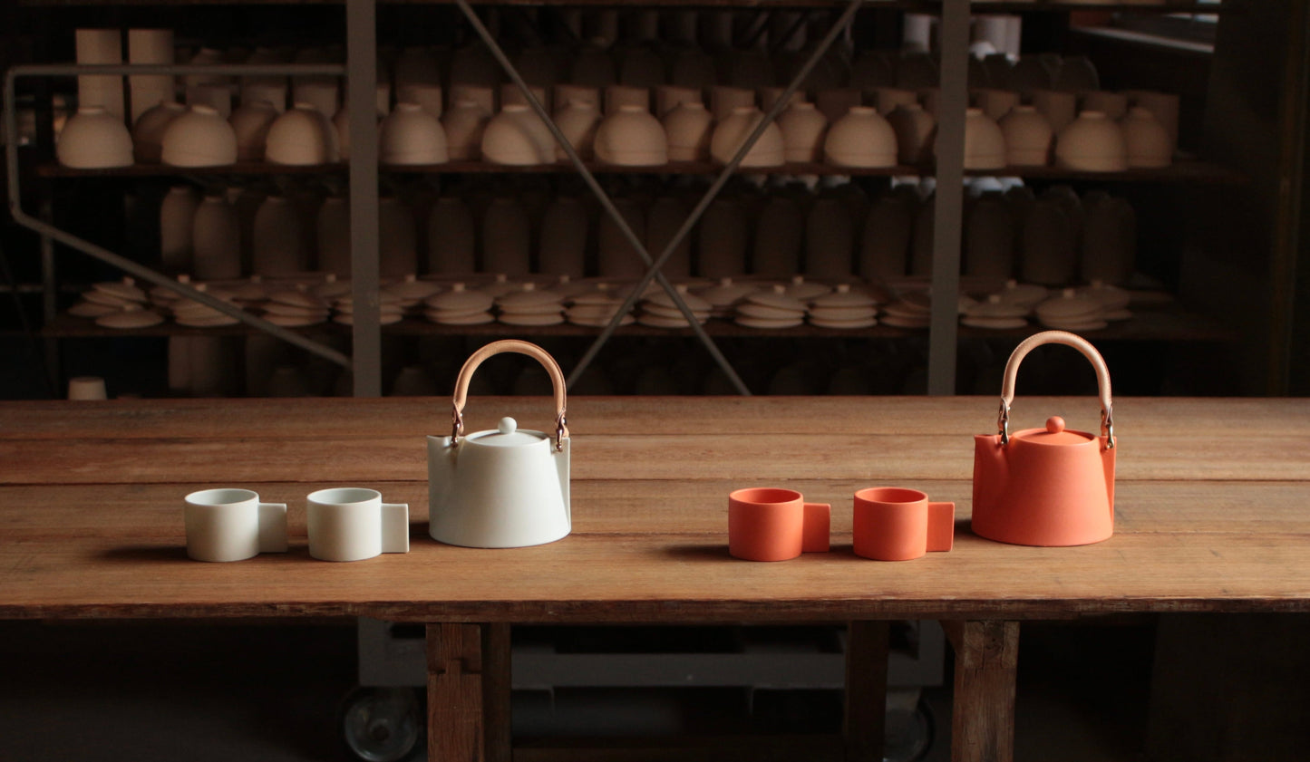 White and Orange Voyage Pot & Cup Sets on the table